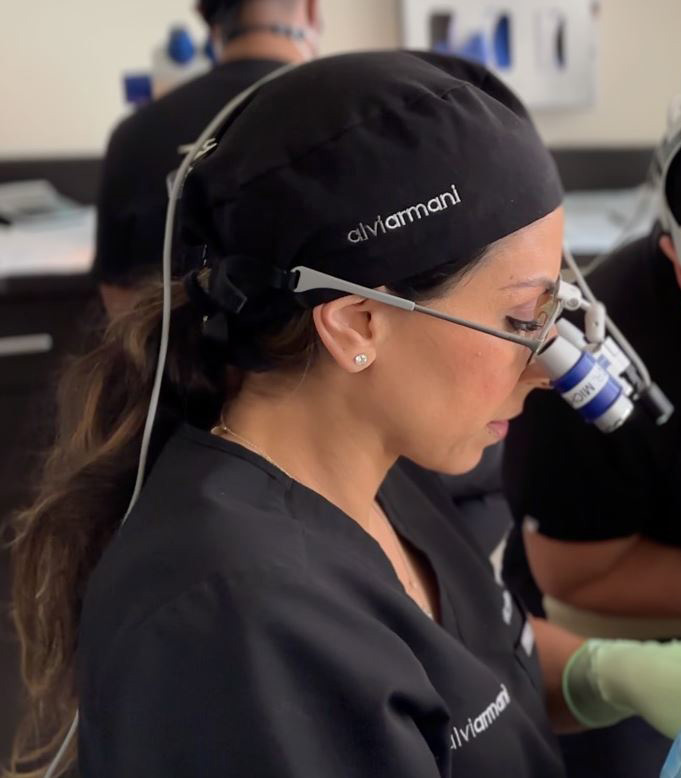 Dr. Michelle Ischayek performing a hair restoration procedure at AlviArmani Beverly Hills